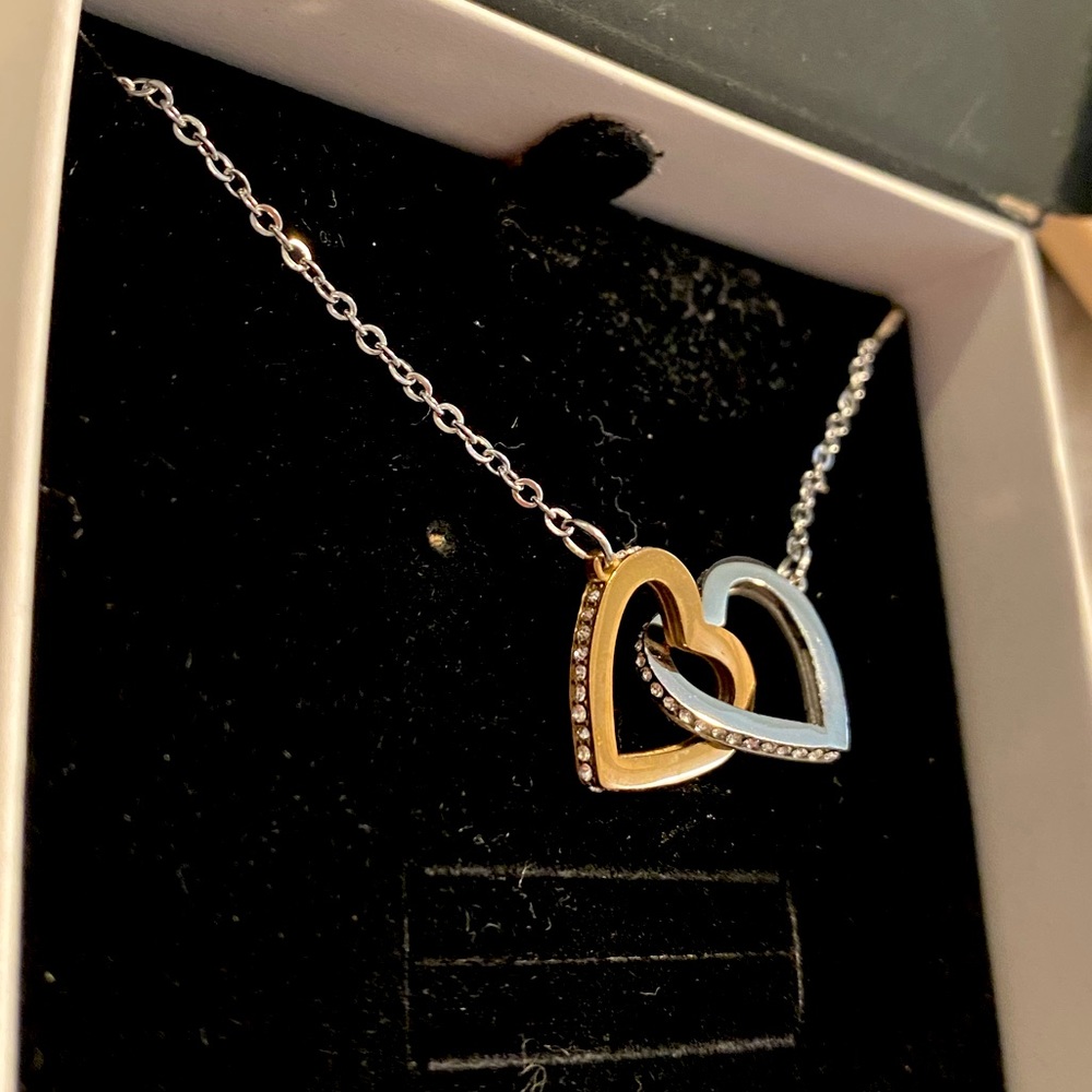 Never worn beautiful gold and silver heart necklace